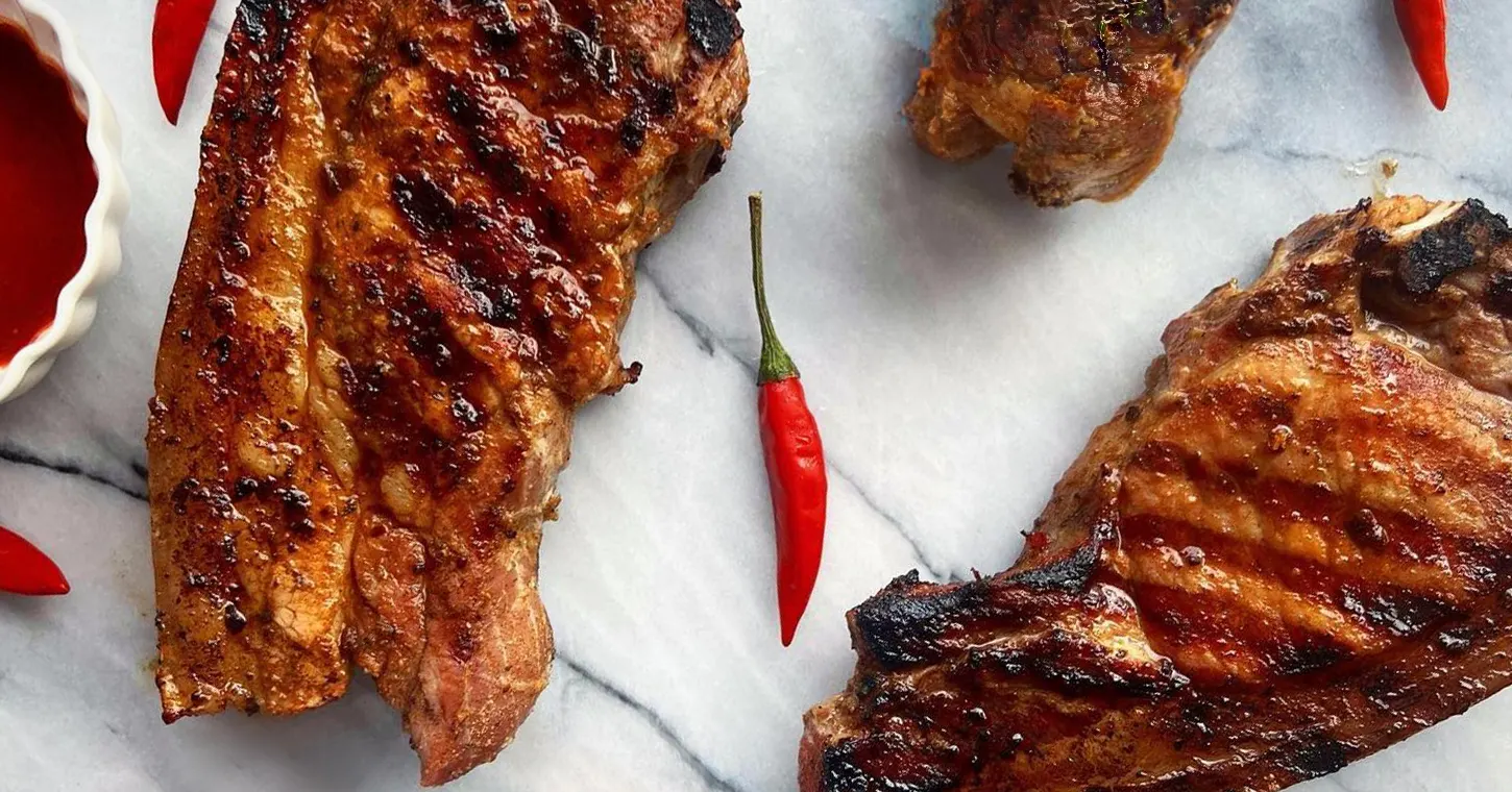 Grilled Pork Chops marinated with Texas BBQ Rub and Hot Sauce