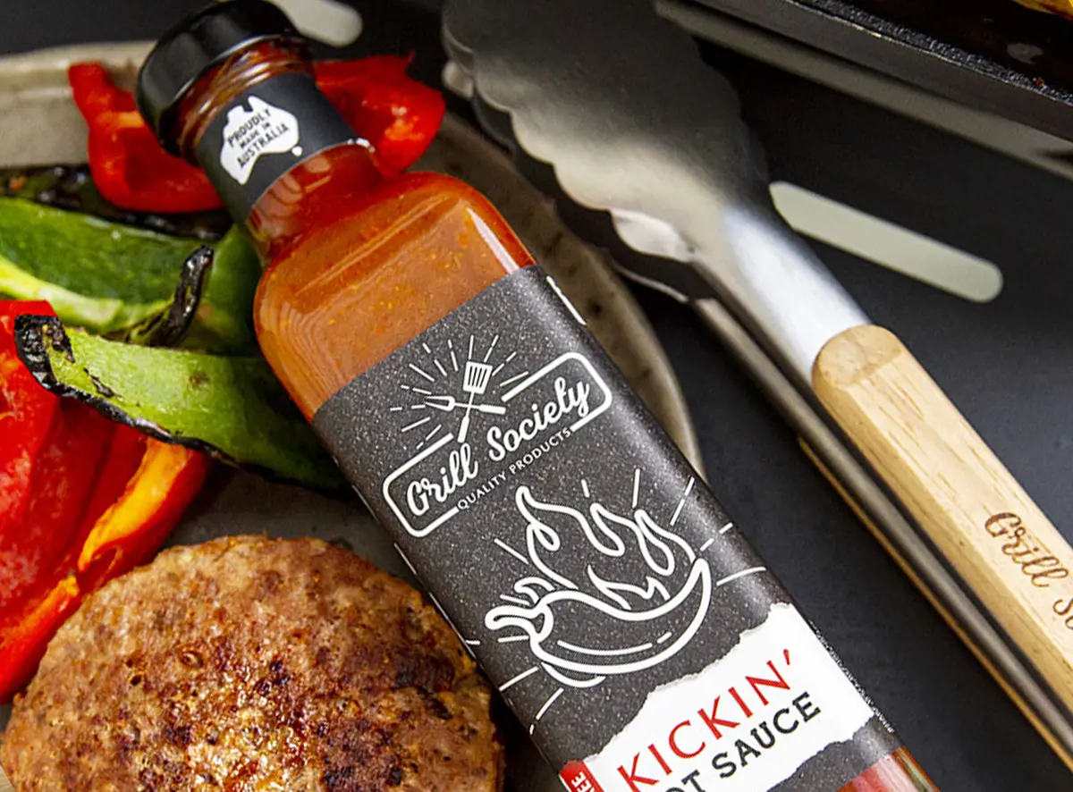 GS BBQ Accessories comprising Kickin Hot Sauce and Tongs