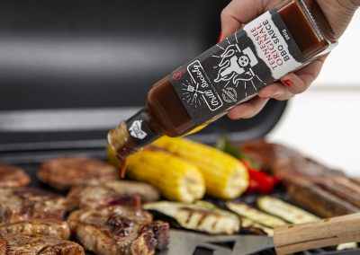 Pouring Tennesse BBQ Sauce on Meat